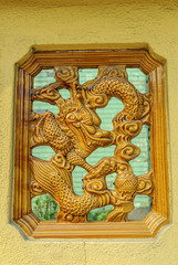 dragon in the window of a Chinese temple in kuala lumpur, Malaysia