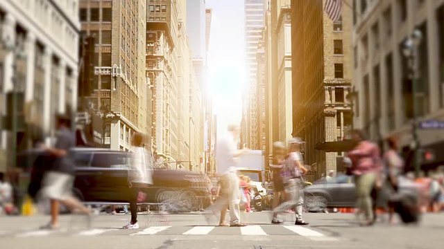 people walking on crowded street in the city. pedestrians commuters background