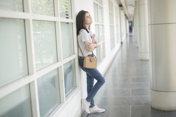 Fototapeta premium A portrait of an Asian university student on campus