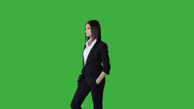 portrait of young caucasian man standing against green screen background
