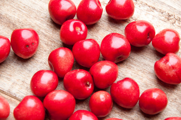Fresh cherries on a wooden table