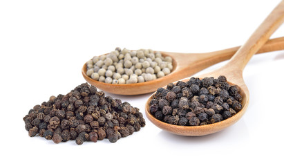 peppercorn in the wooden spoon on white background