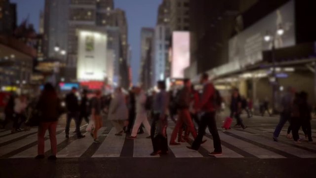 time lapse video of people walking in the city. pedestrians crossing street