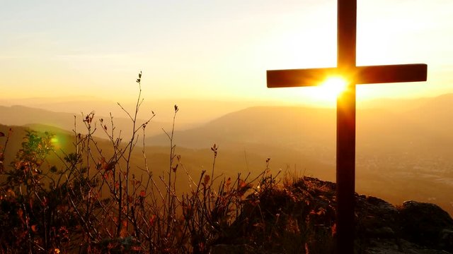 believe in faith symbol. rest in peace. silhouette of grave cross at sunset