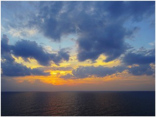 Sun Setting in Blue Sky