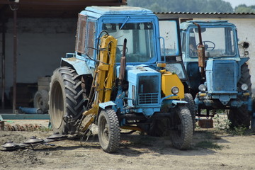 Fototapeta na wymiar Russia, Temryuk - 15 July 2015: Tractor, standing in a row. Agricultural machinery. Parking of agricultural machinery.