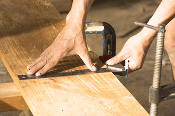Carpenter working around Measuring stick and working plan.Close up and stillife