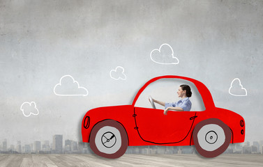 Woman driving old styled drawn car  . Mixed media