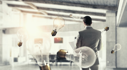 Businessman in modern office   . Mixed media