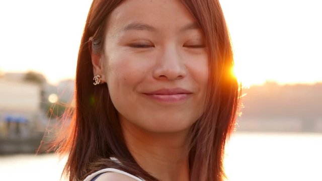 lifestyle portrait of young cute asian women looking at camera. city people view