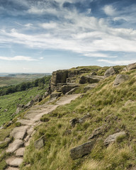 Magnificent landscape of rock formations and moorland at Stanage Edge in the Peak District in Derbyshire, a stunning area of great natural beauty covering 555 square miles across central England