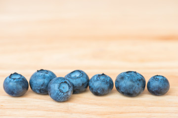 Blueberry on wooden table background