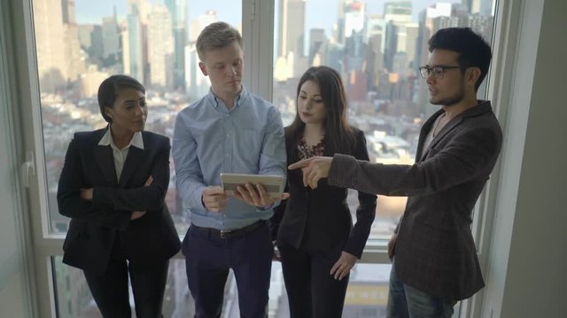 young diverse multi ethnic group of business professionals talking together