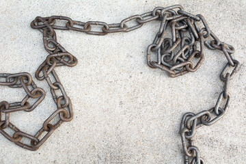 Old chain on cement floor