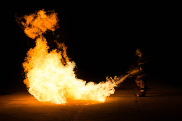 Man in fire show after Firefighters training, Rehearse of firefighters from cooking.