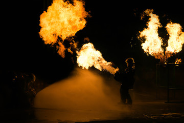 Man in fire show after Firefighters training, Rehearse of firefighters from cooking.