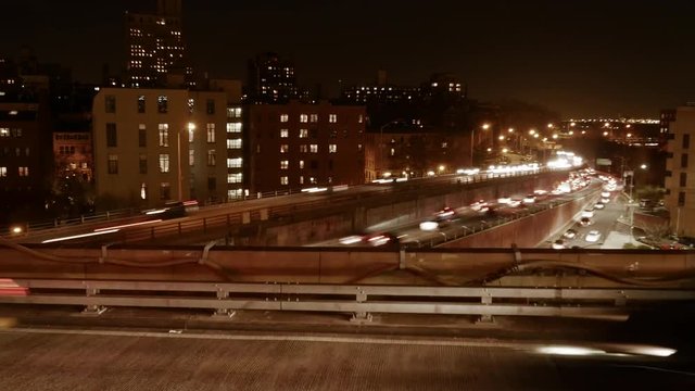 city urban traffic at night lights. cars moving time lapse