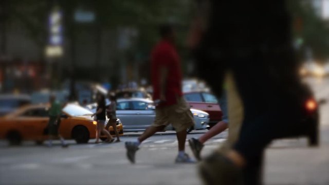 people walking on crowded street in the city. pedestrians commuters background