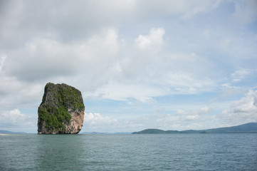 Poda Island, Speed boats and Thai traditional boat anchored in a amazing blue water beach in Krabi, Thailand.