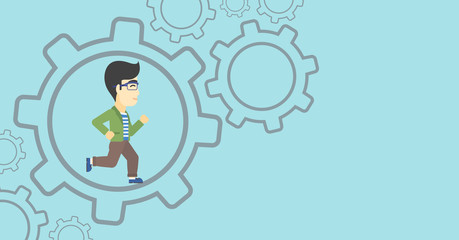 Businessman running inside the gear.