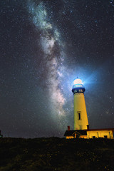 Naklejka na ściany i meble Milky way over Pogeon Point Lighthouse