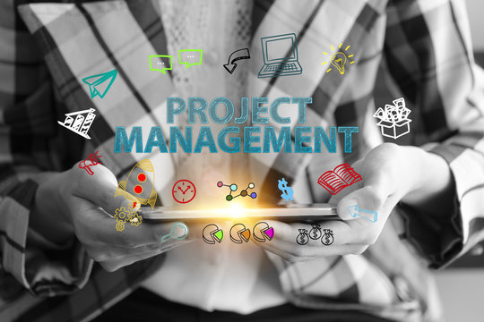 business holding a smart phone with PROJECT MANAGEMENT text