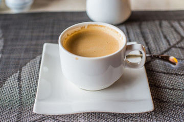 Hot coffee on the white cup