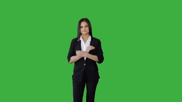 portrait of young caucasian man standing against green screen background