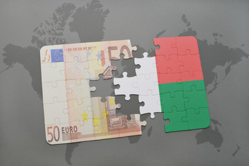 puzzle with the national flag of madagascar and euro banknote on a world map background.