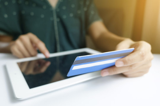 woman holding  credit card with tablet .  Shopping Online 