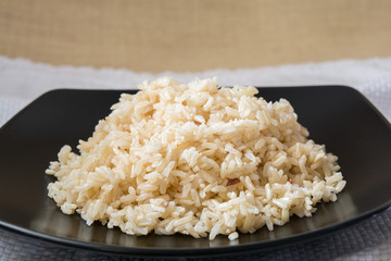 brown Rice on black plate