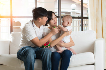 asian parent playing with baby