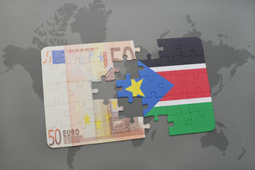 puzzle with the national flag of south sudan and euro banknote on a world map background.