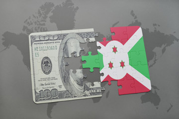 puzzle with the national flag of burundi and dollar banknote on a world map background.