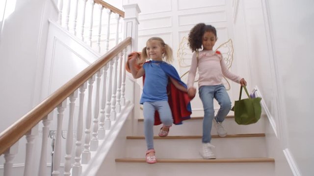 Two Girls Running Down Staircase Shot In Slow Motion