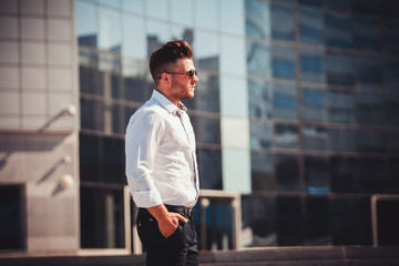 serious successful man in shirt and glasses