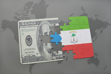 puzzle with the national flag of equatorial guinea and dollar banknote on a world map background.