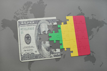 puzzle with the national flag of mali and dollar banknote on a world map background.