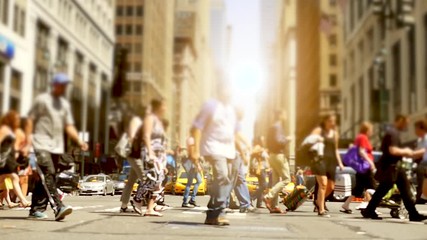 anonymous people walking on crowded street in the city. new york city background
