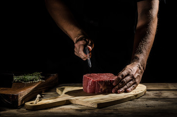 Chef butcher prepare beef steak