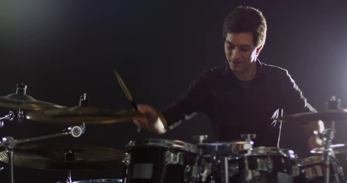 Drummer Playing Drum Kit 