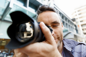 Male photographer taking picture