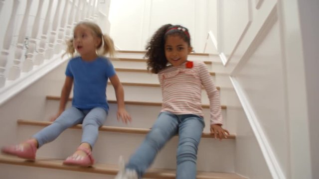 Two Girls Playing On Staircase Shot In Slow Motion