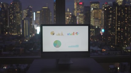 two young business professionals standing in modern city office talking together