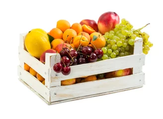 Gordijnen Wooden box with different fruits © Nataliia Pyzhova