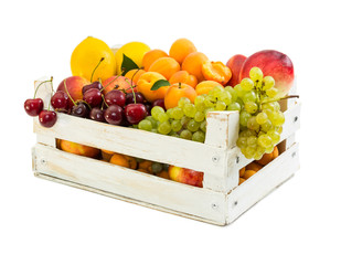 Wooden box with different fruits
