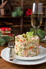 Russian traditional salad Olivier with vegetables and meat