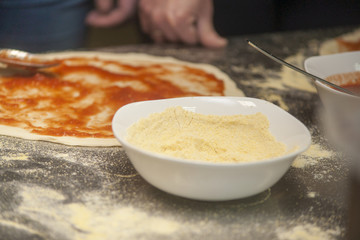 Woman chef with raw dough.