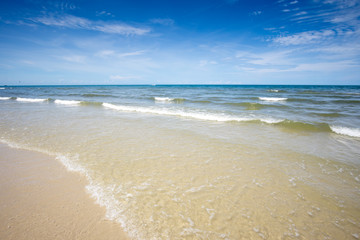Fototapeta na wymiar Beautiful blue sea wave on white sand beach at Hua Hin, Prachuap KhiriKhan Province,Thailand. 