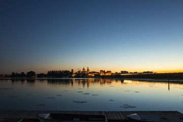 Fototapeta premium Europe Italy Mantova-Mantua ancient castle at the river reflecti